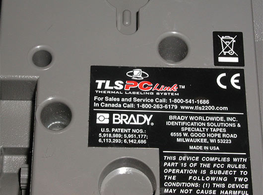 Close-up image of an electronic product with a WEEE label showing the crossed-out wheeled bin symbol, indicating it should be recycled.